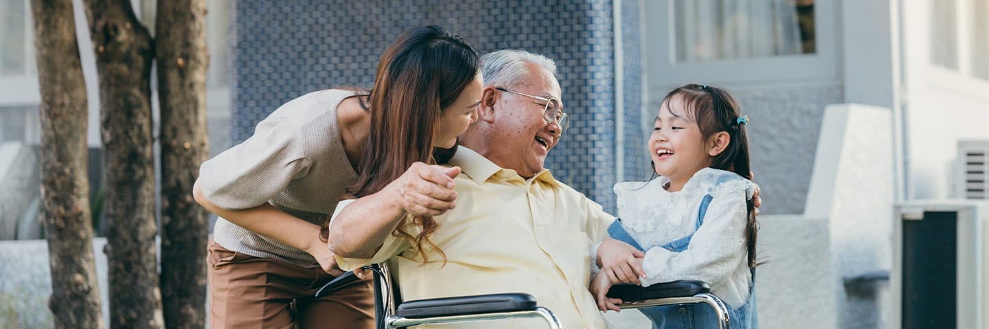 Family outside together with senior loved one