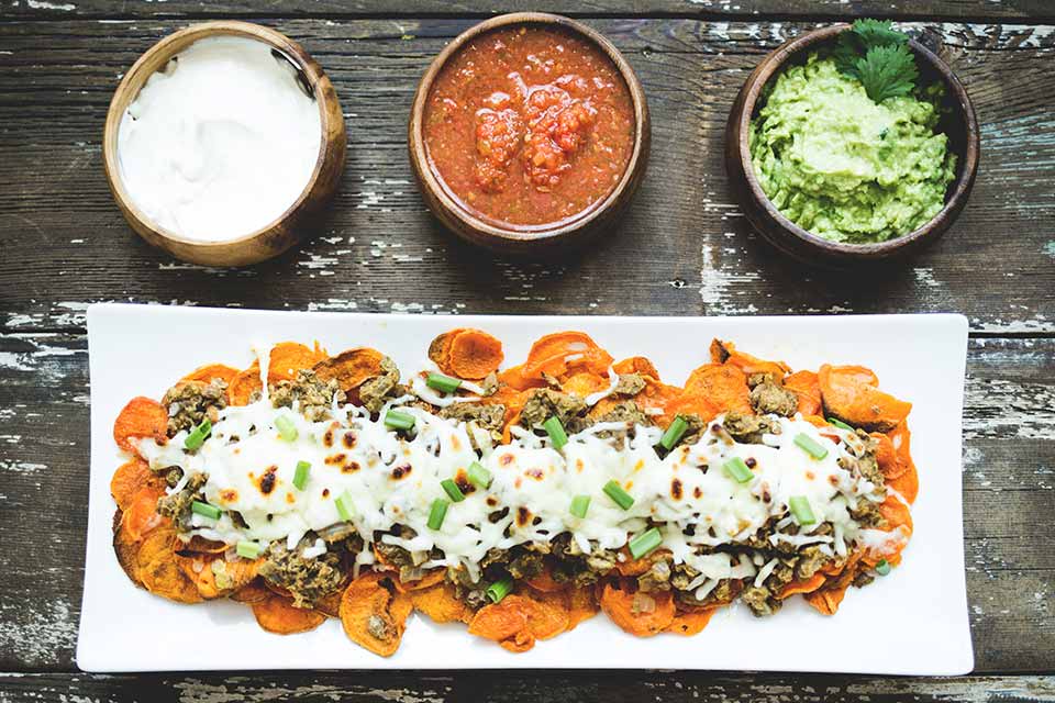 Veggie nachos with three dips