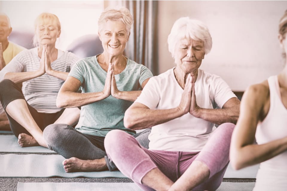 A group of seniors perform exercises for arthritis.