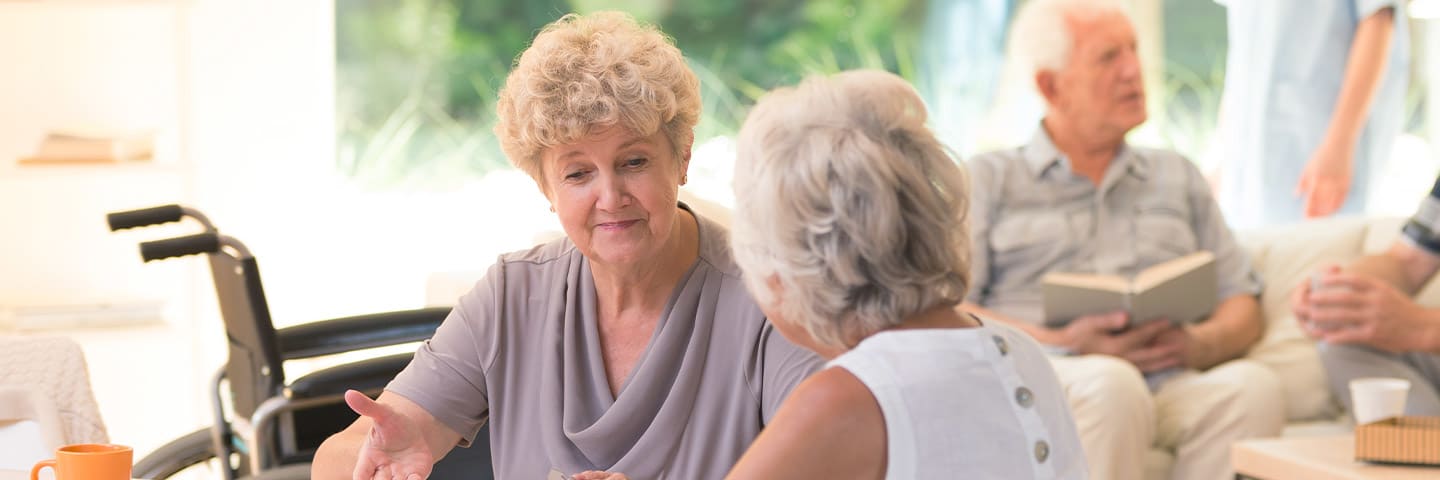 Group of seniors chatting in a common area