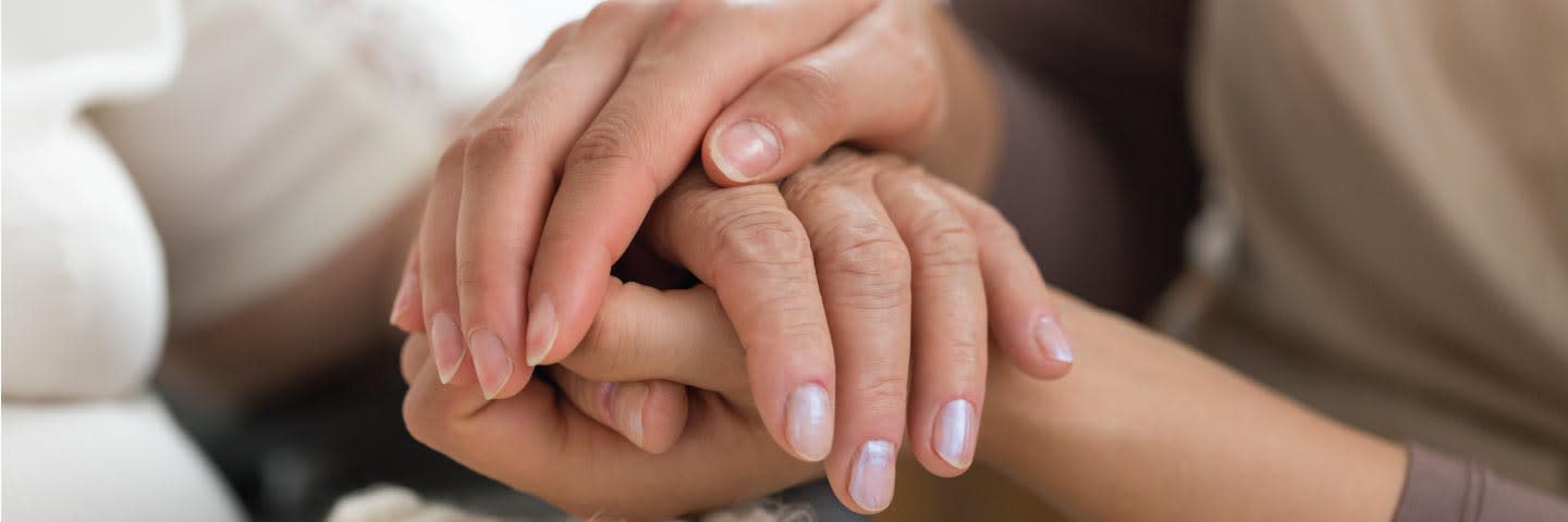 Close up of seniors holding hands