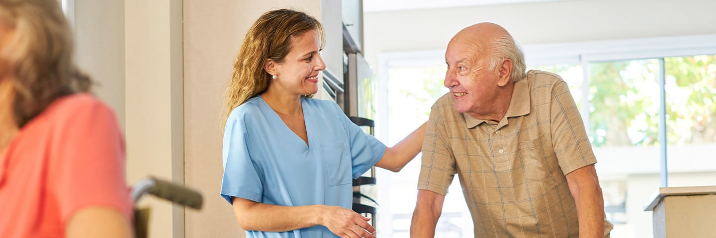 Caregiver and senior working on walking