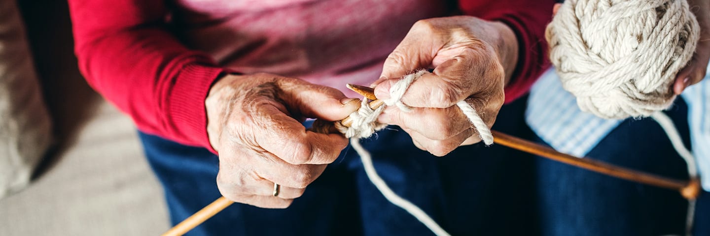 Senior hands knitting