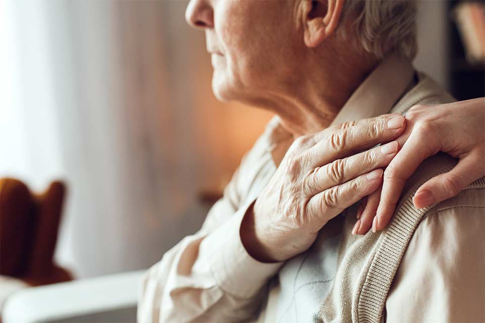 Elderly couple struggling to cope with dementia behaviors.