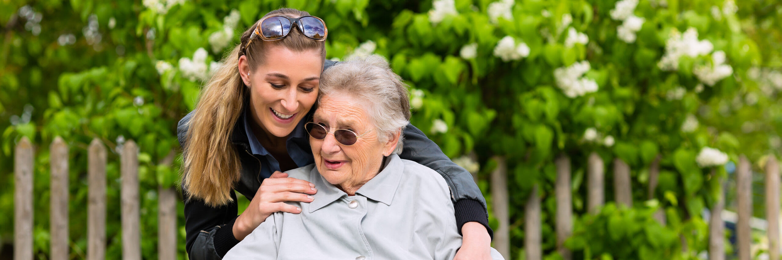 Senior and caregiver sharing an embrace