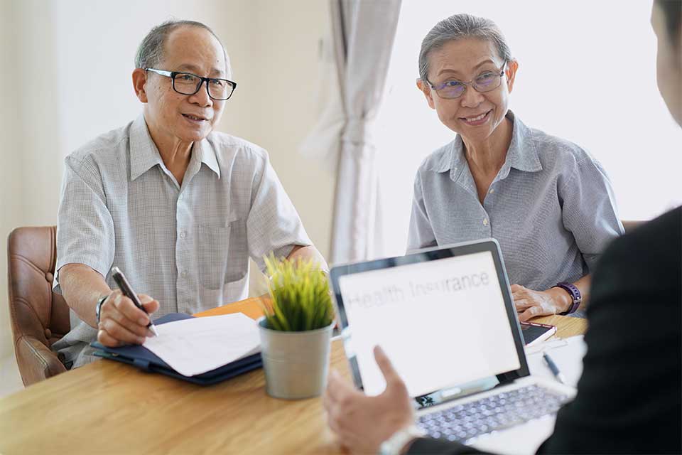 Elderly couple working with their geriatric care manager to make senior care plans.