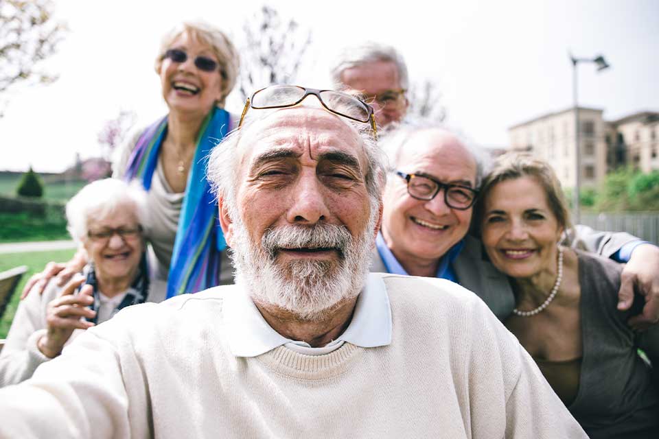 Large family of elder siblings finding agreement on senior care options for their father with the help of a mediator.