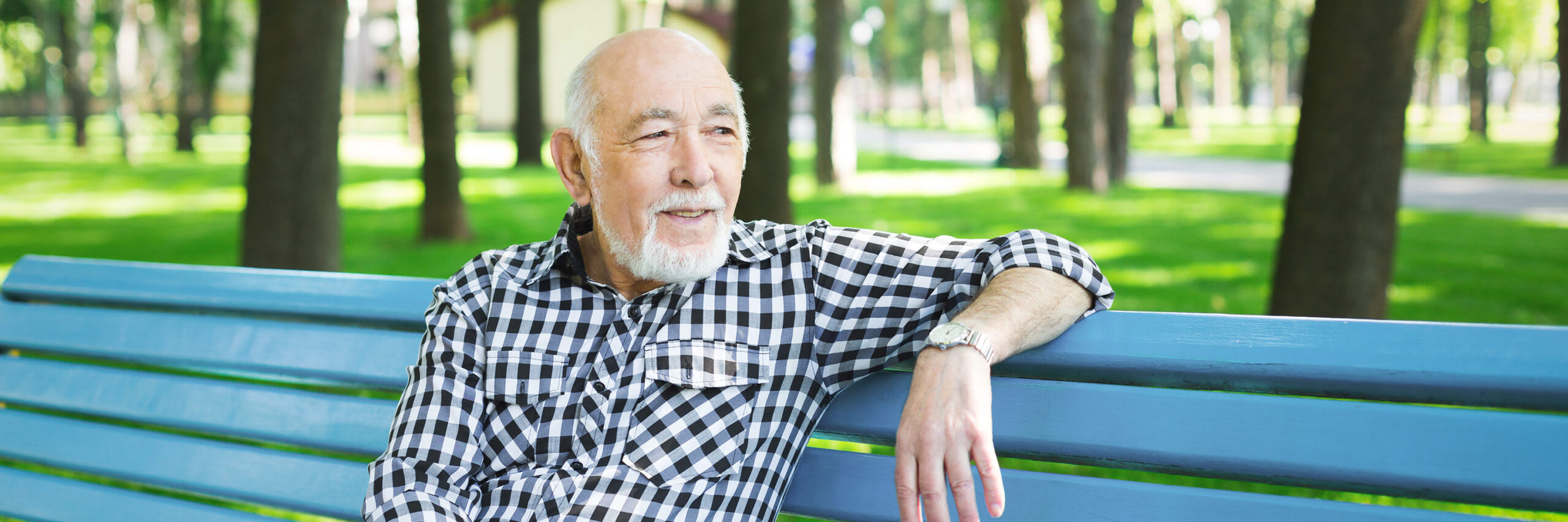 Senior sitting on park bench